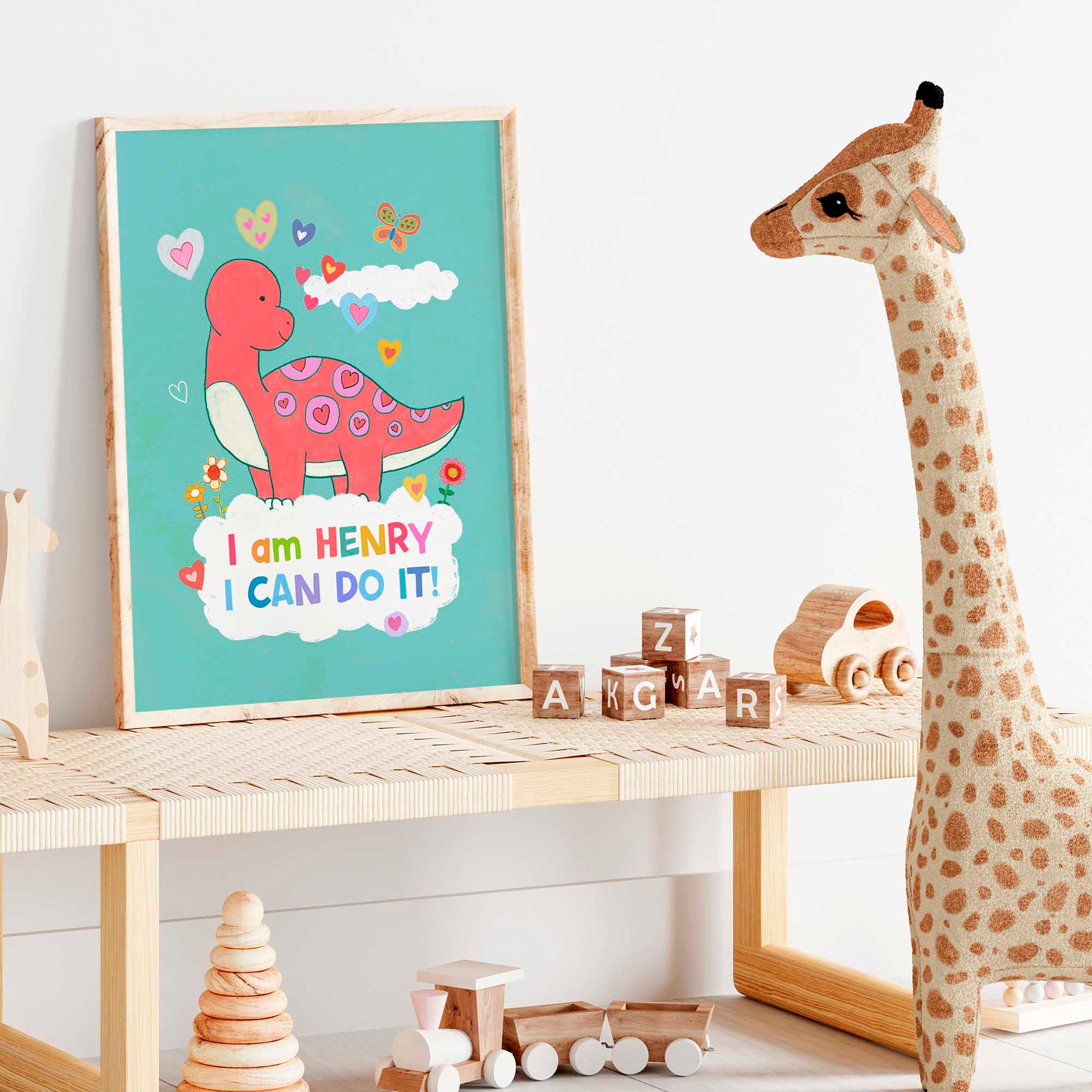 Boy's nursery enhanced with dinosaur framed art, combining kids' wall art with empowering sayings.